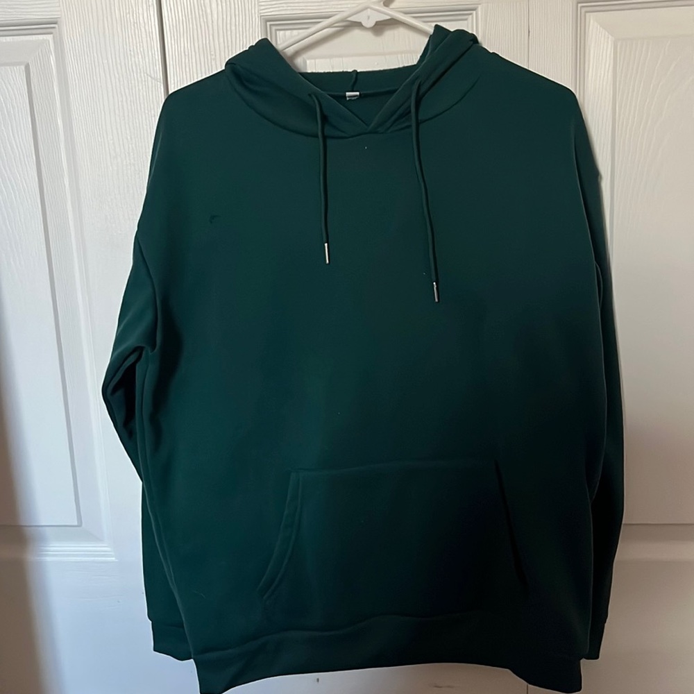 Green hoodie with butterfly and wording in the back “ let’s float together baby”